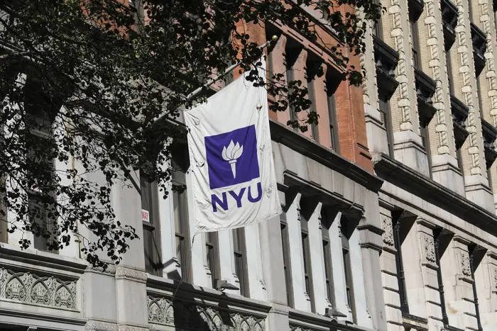 A NYU banner is seen on a building of New York University in New York City.
